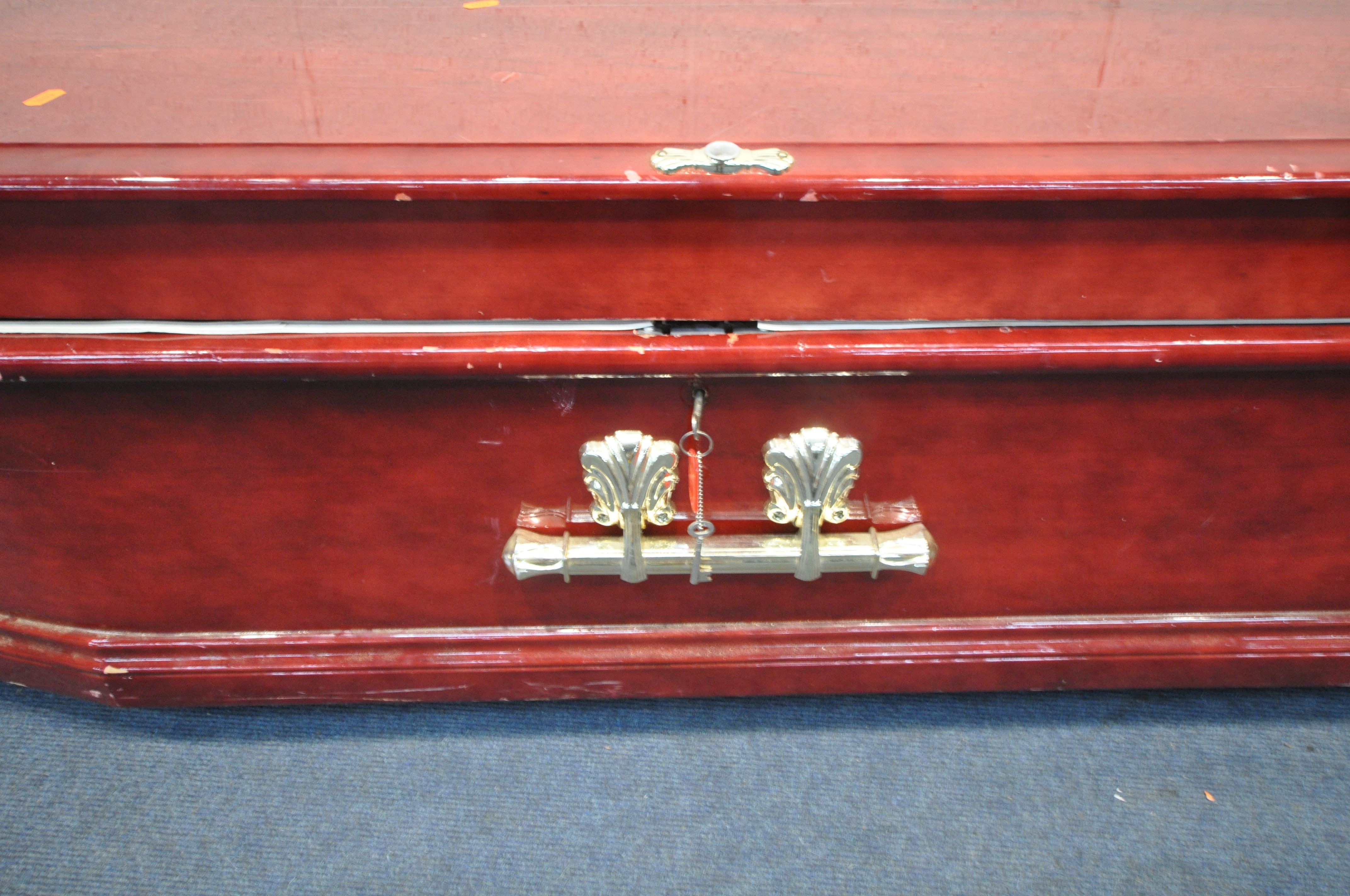 A BESPOKE COFFIN, with a glossy red finish, plastic finials and handles, length 211cm x depth 62cm x - Image 6 of 6