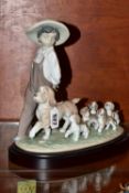 A LARGE LLADRO 'MY LITTLE EXPLORERS' SCULPTURE, model no 6828, depicting a boy leading his dog and