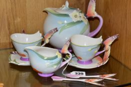 AN EIGHT PIECE FRANZ PORCELAIN PART TEASET, with butterfly handles and moulded flowers, comprising a