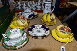 A GROUP OF AYNSLEY 'ORCHARD GOLD' YELLOW CUPS AND COALPORT BATWING TEAWARES comprising Aynsley '