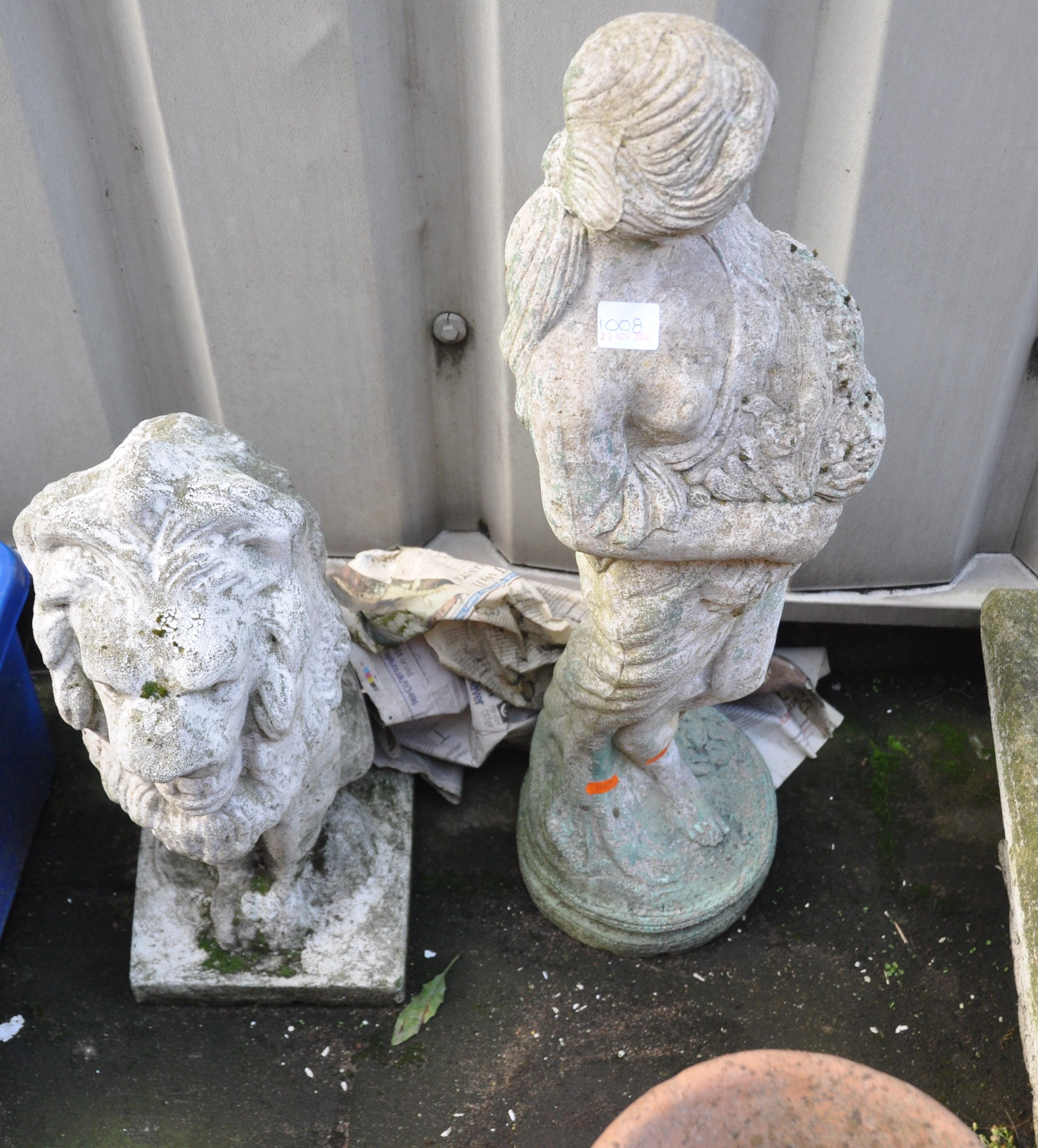 TWO COMPOSITE GARDEN FIGURES comprising of a seated lion 56cm high and a Grecian flower girl 78cm