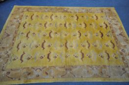 A WOOLMARK YELLOW GROUND RUG, 248cm x 172cm