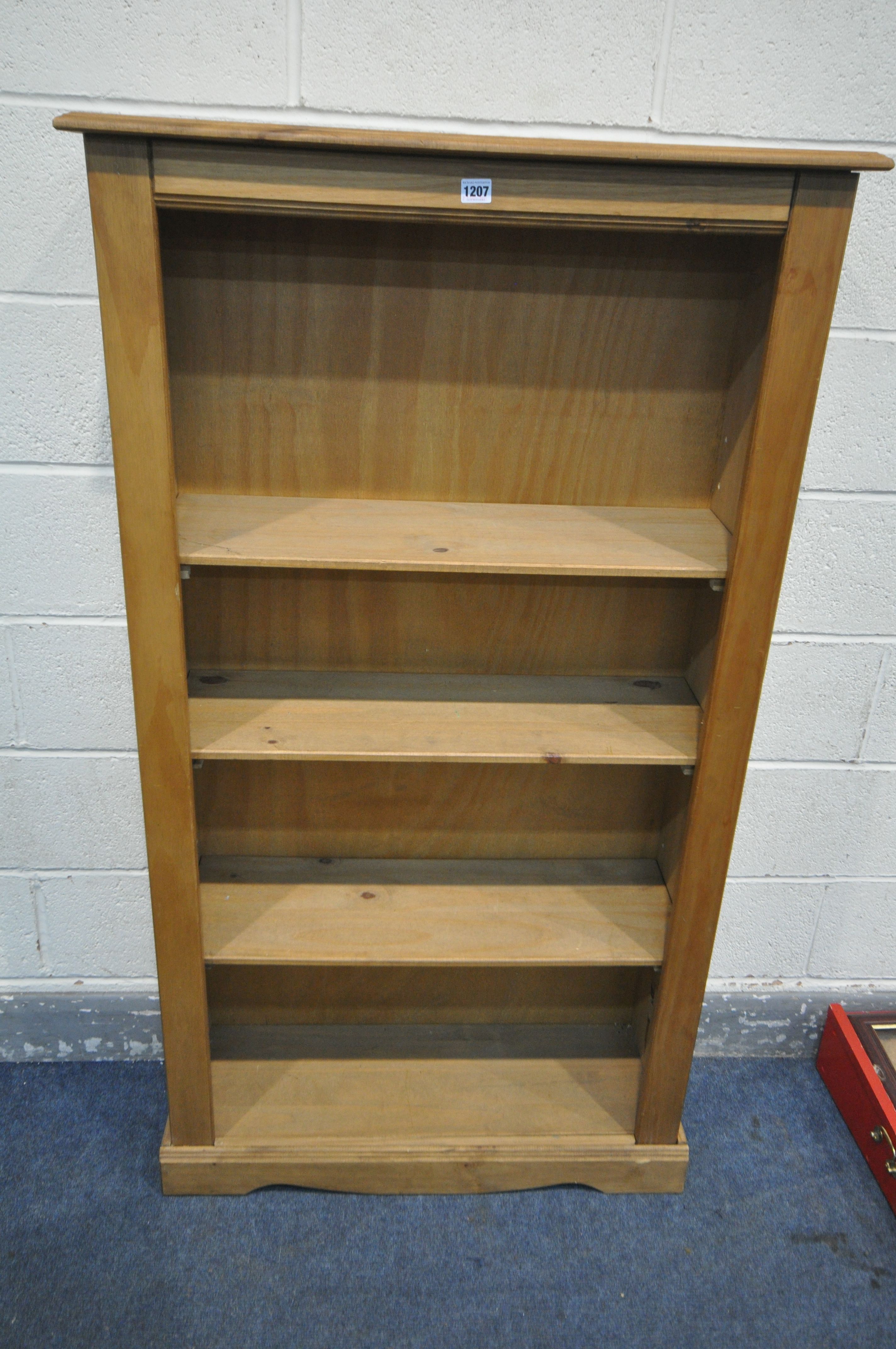 A MODERN PINE OPEN BOOKCASE, with three shelves (condition - damage to top, other imperfections)