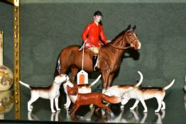 A BESWICK GROUP OF A MOUNTED HUNTSMAN, HOUNDS AND A FOX, comprising Huntsman model no 1501 height