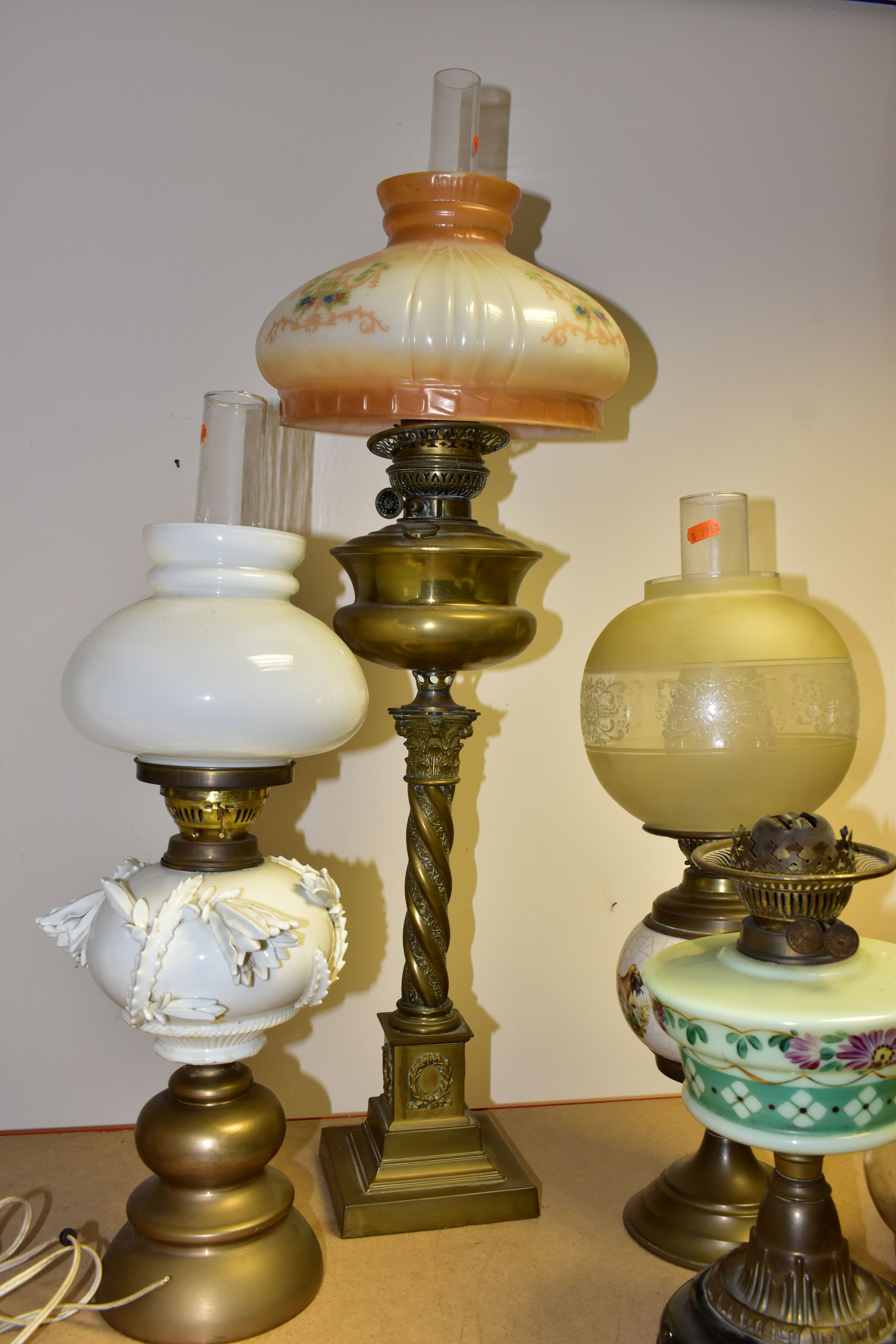 FOUR VICTORIAN OIL LAMPS, comprising an Eltex oil lamp with a brass base and fittings a white - Image 9 of 11