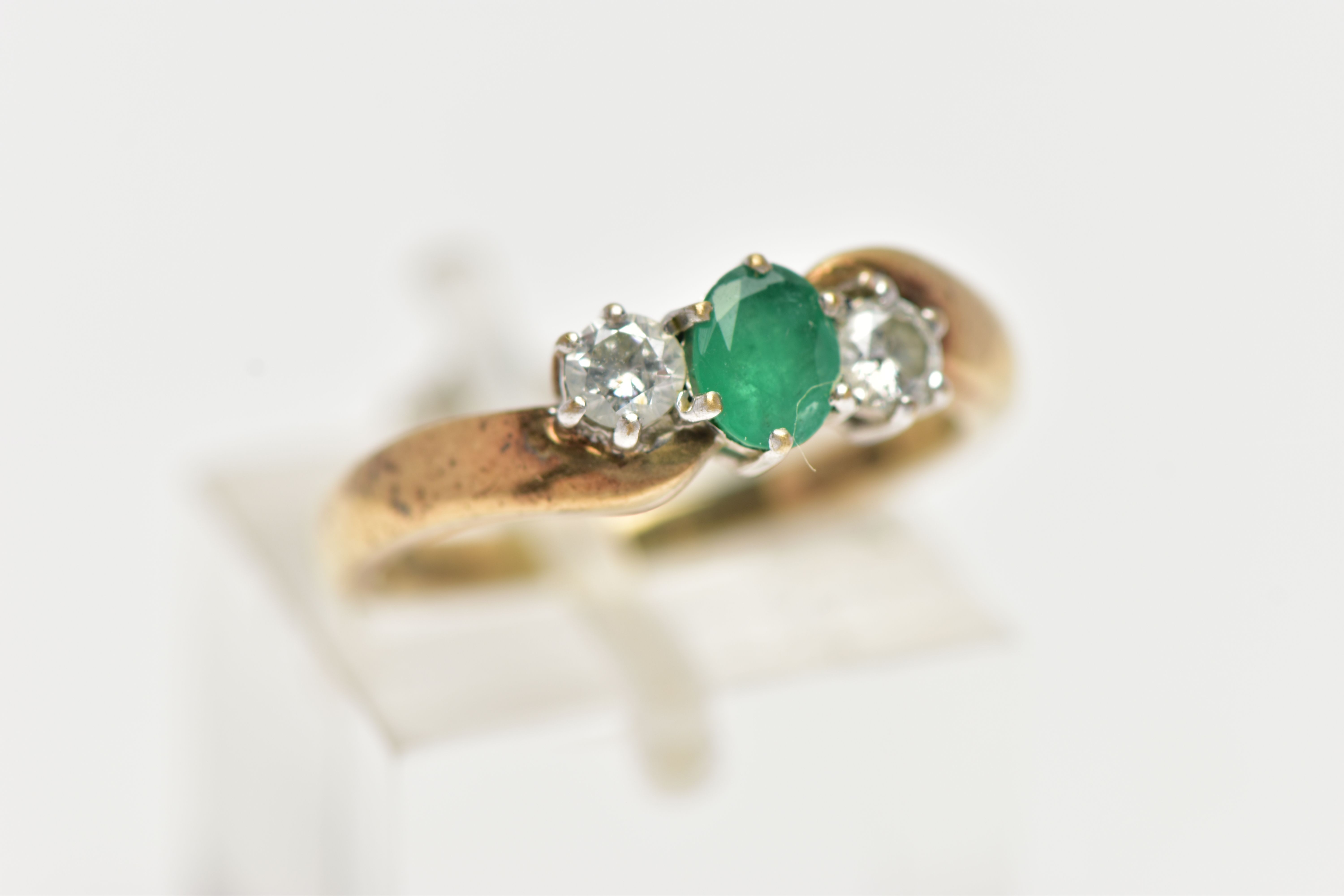 A 9CT GOLD EMERALD AND DIAMOND RING, centrally set with an oval cut emerald in a six claw setting, - Image 4 of 4