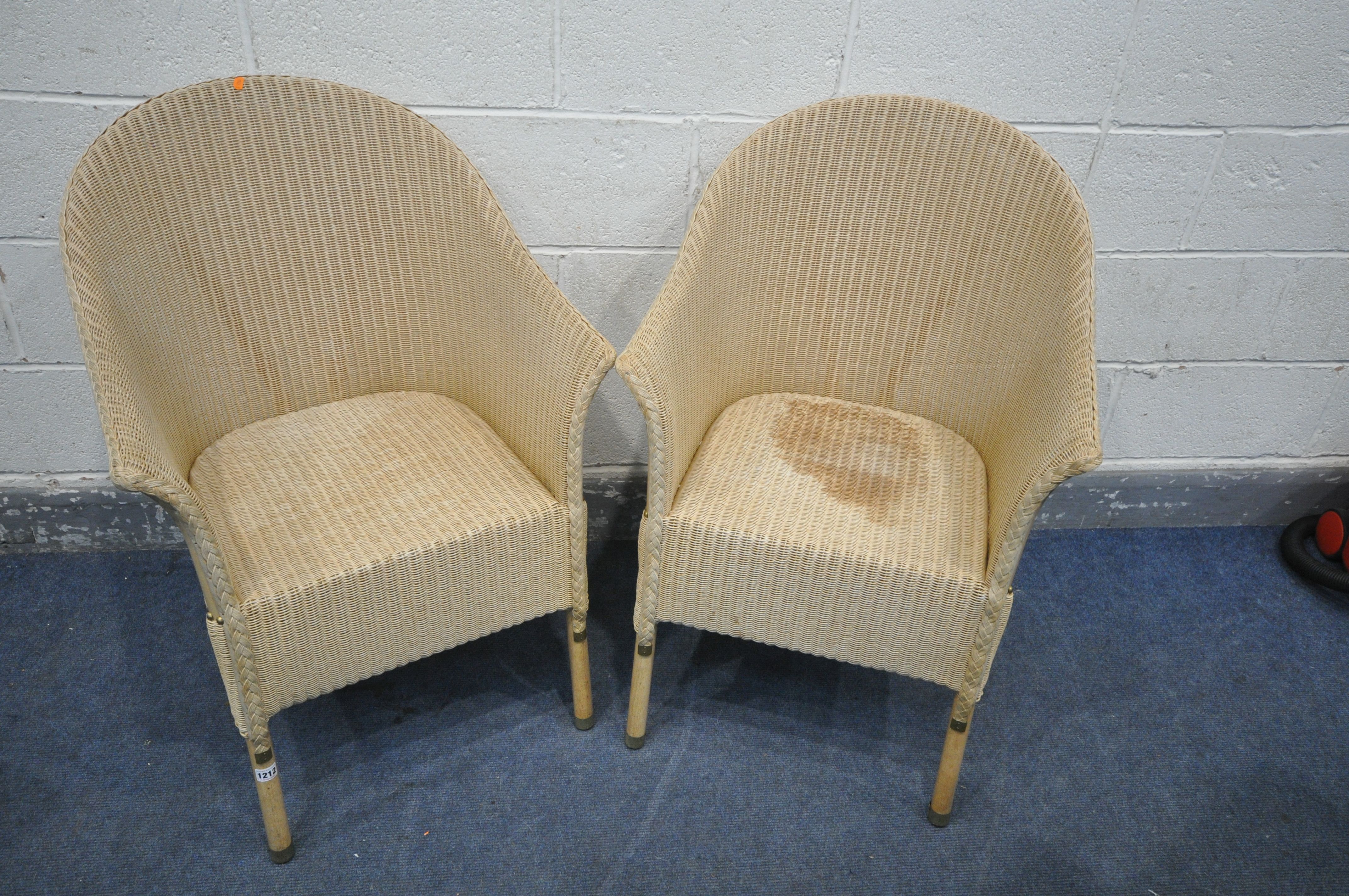 A PAIR OF CREAM PAINTED LLOYD LOOM TUB CHAIRS, condition - stain to one seat, other
