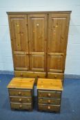 A PINE TRIPLE DOOR WARDROBE, with four drawers, width 133cm x depth 52cm x height 180cm, and a