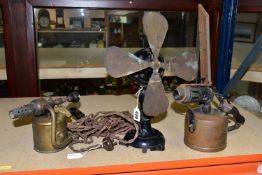 A VINTAGE DESK FAN AND TWO BLOW TORCHES, the adjustable four bladed fan in need of some attention,