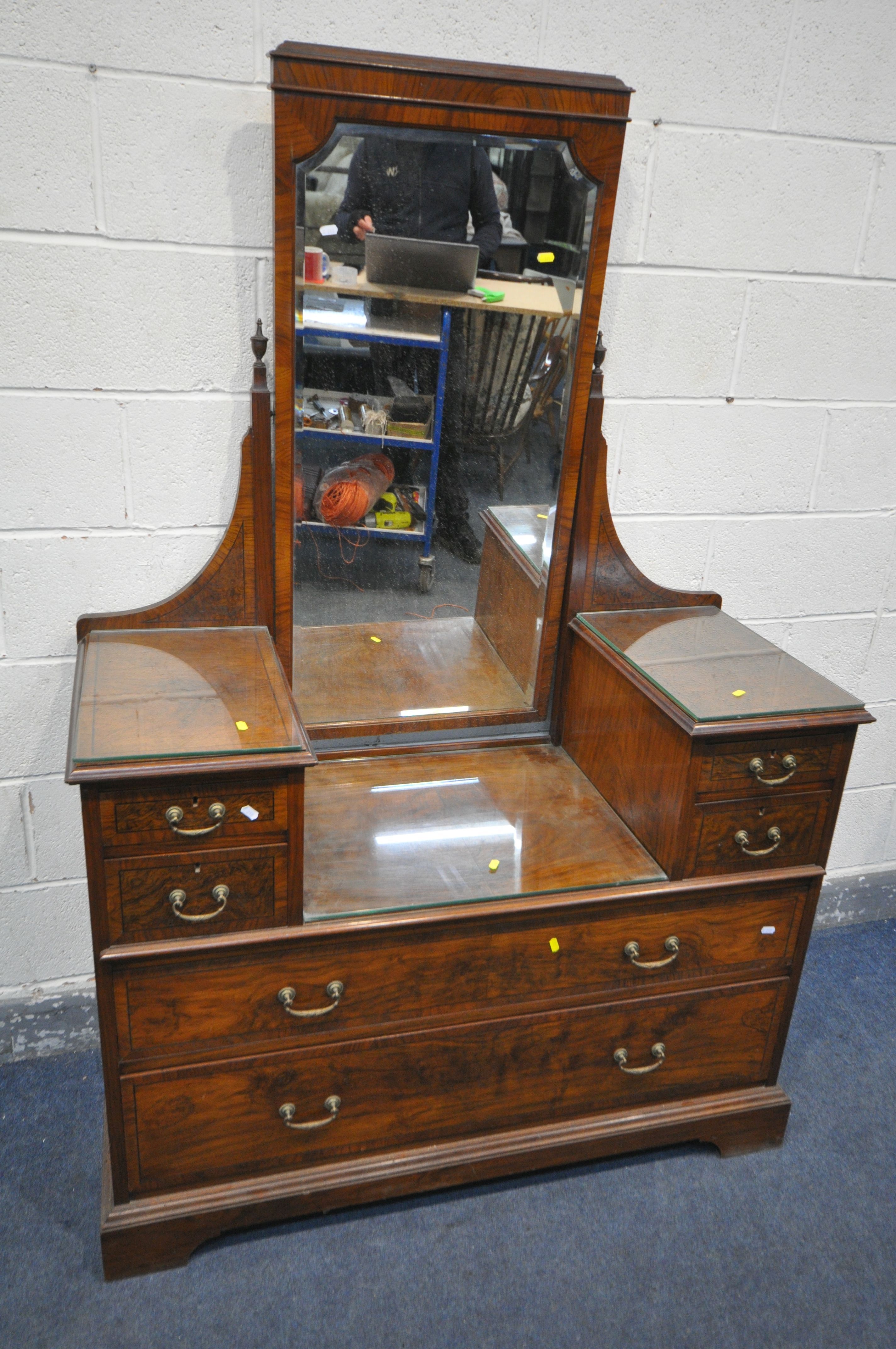 A 20TH CENTURY WALNUT DRESSING CHEST, with a single rectangular swing mirror, and an arrangement