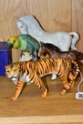 FOUR BESWICK ANIMAL AND BIRD FIGURES, comprising a Tigress model no 1486 (rear right leg broken