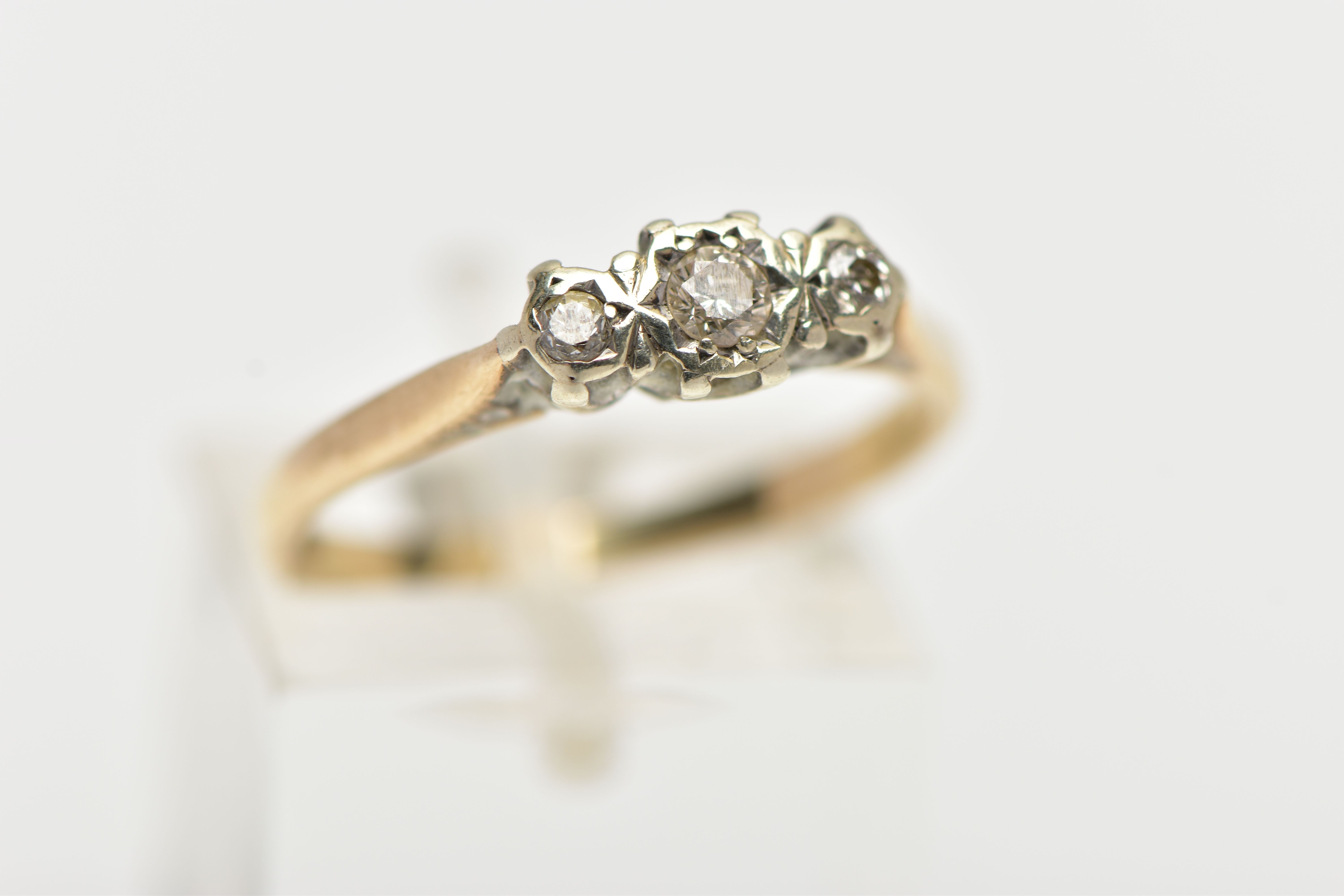 A 9CT GOLD THREE STONE DIAMOND RING, three round brilliant cut diamonds prong set in white metal - Image 4 of 4