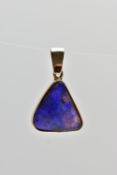 A YELLOW METAL OPAL PENDANT, of a triangular form, set with an opal cabochon displaying blues and