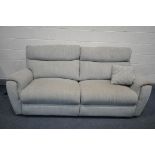 A BEIGE UPHOLSTERED THREE SEATER ELECTRIC RECLINING SOFA (condition - signs of usage, PAT pass and