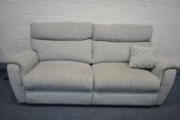 A BEIGE UPHOLSTERED THREE SEATER ELECTRIC RECLINING SOFA (condition - signs of usage, PAT pass and