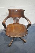 AN EARLY 20TH CENTURY OAK SWIVEL OFFICE CHAIR (condition:-repair to crack on seat)