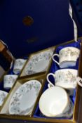 A PRESENTATION BOXED SET OF COALPORT 'MY FAIR LADY' PATTERN TEA CUPS AND SAUCERS, comprising six
