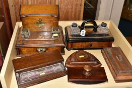 THREE SETS OF VICTORIAN AND EDWARDIAN CUT GLASS INK WELLS AND STANDS, comprising a mahogany ink