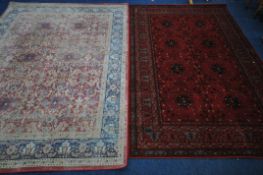 A LATE 20TH CENTURY JOHN LEWIS RED GROUND RUG, 300cm x 200cm, and another late 20th century