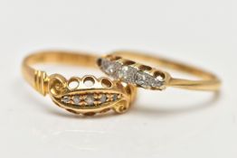 TWO EARLY 20TH CENTURY DIAMOND RINGS, the first set with five small rose cut diamonds, within an