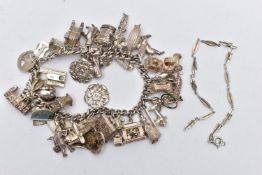 A WHITE METAL CHARM BRACELET, a curb link bracelet, fitted with a large quantity of white metal