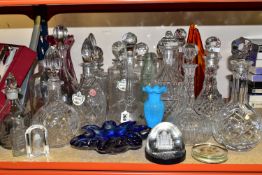 A LARGE QUANTITY OF CUT CRYSTAL DECANTERS AND COLOURED GLASS, comprising a purple ribbed vase (