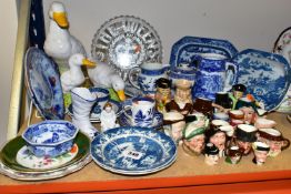 A GROUP OF BLUE AND WHITE CERAMICS AND MINIATURE CHARACTER JUGS, comprising three 19th century