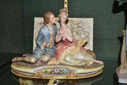 A CAPODIMONTE FIGURE GROUP, entitled 'Lovers' sculpted by Bruno Merli, signature and Capodimonte