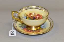 AN AYNSLEY FLORAL DECORATED TEA CUP AND SAUCER BY J. A. BAILEY, with scrolling border, the cup