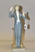 A LLADRO 'MAESTRO, MUSIC PLEASE' FIGURE, model no 5196, depicts a conductor with his baton, height
