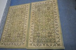 A PAIR OF HERITAGE GREEN GROUND RUGS, with foliate design 140cm x 80cm, and a similar runner,