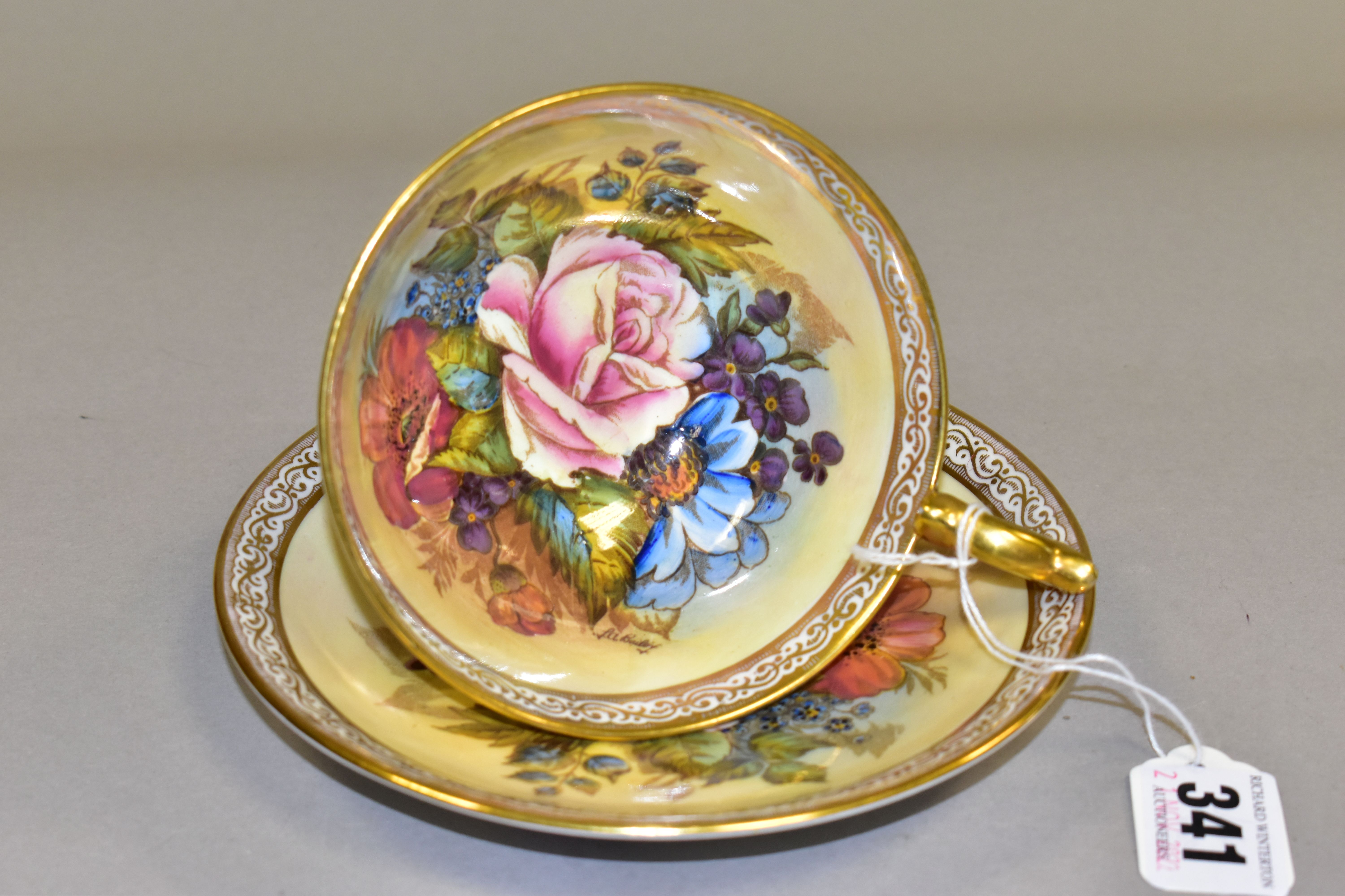 AN AYNSLEY FLORAL DECORATED TEA CUP AND SAUCER BY J. A. BAILEY, with scrolling border, the cup - Image 2 of 4