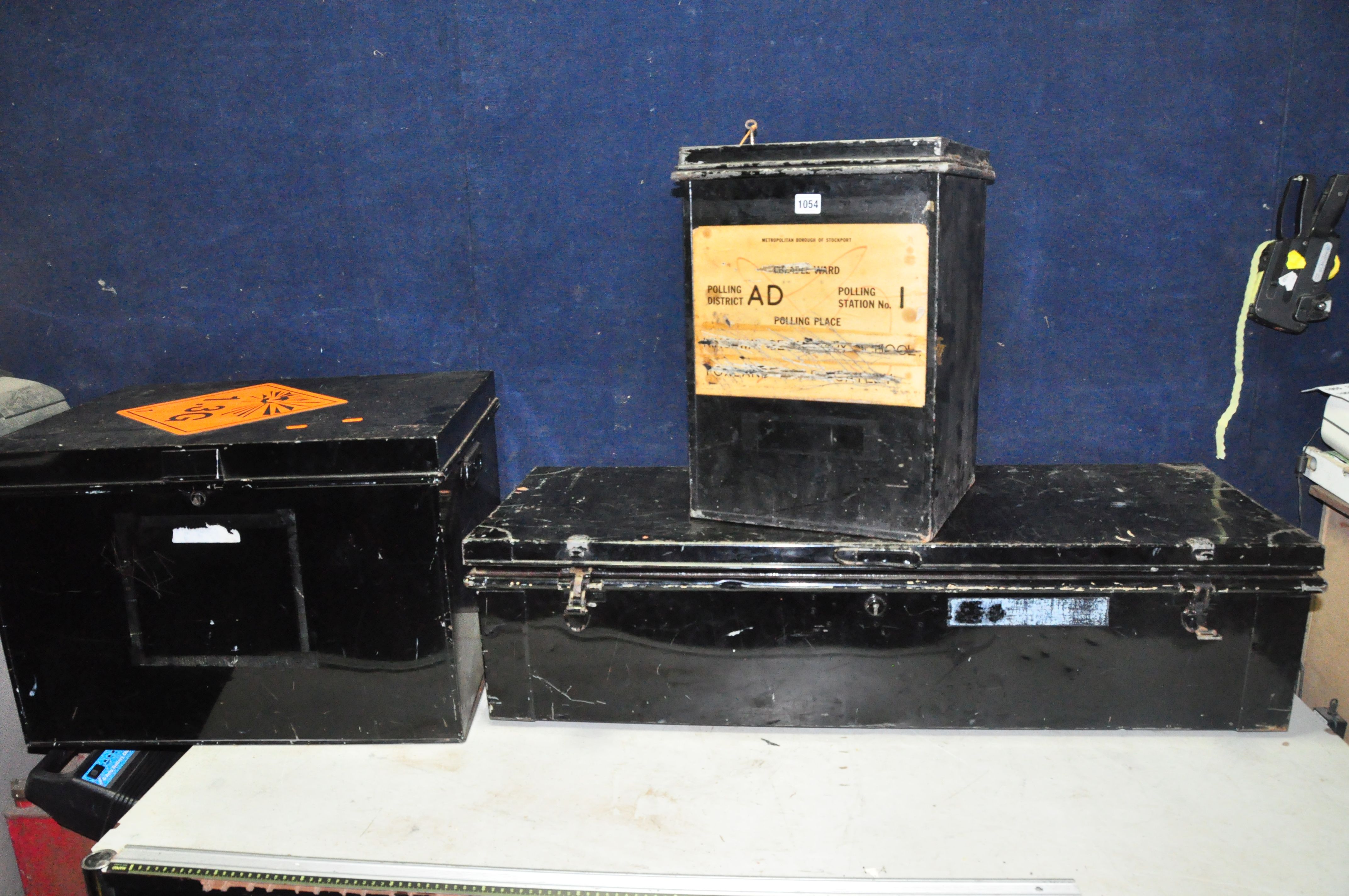 THREE VINTAGE METAL BOXES including a Stockport Ballot box with one key, a long lidded transit box