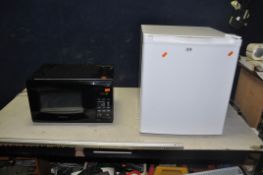 A CURRYS ESSENTIAL TABLE TOP FRIDGE (width 44cm depth 47cm height 51cm) and a Daewoo Microwave (both