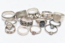 AN ASSORTMENT OF SILVER AND WHITE METAL RINGS, to include a silver and hematite signet ring,