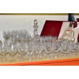 A QUANTITY OF CUT GLASS, comprising a boxed Hennessy Paradis Extra Rare Cognac decanter, four Stuart