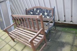 TWO GARDEN BENCHES comprising of a 128cm wide cast iron ended bench with cast iron panel to back and