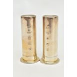 A PAIR OF MODERN SILVER PEPPERETTES, each in the form of a polished shot gun case, stamped to the