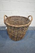 A WICKER LOG BASKET, with twin handles, diameter 59cm x height 60cm (condition - signs of heavy