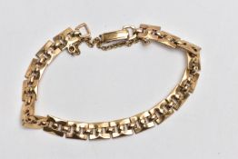 A 9CT GOLD BRACELET, featuring a series of square links with ball detailing, fitted with a fold over