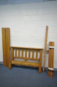 A SOLID OAK 4FT6 BEDSTEAD, with side rails, bolts and slats