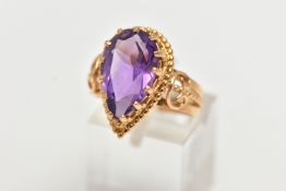 AN 18CT GOLD AMETHYST RING, designed with a pear cut amethyst, in a thirteen claw setting, measuring
