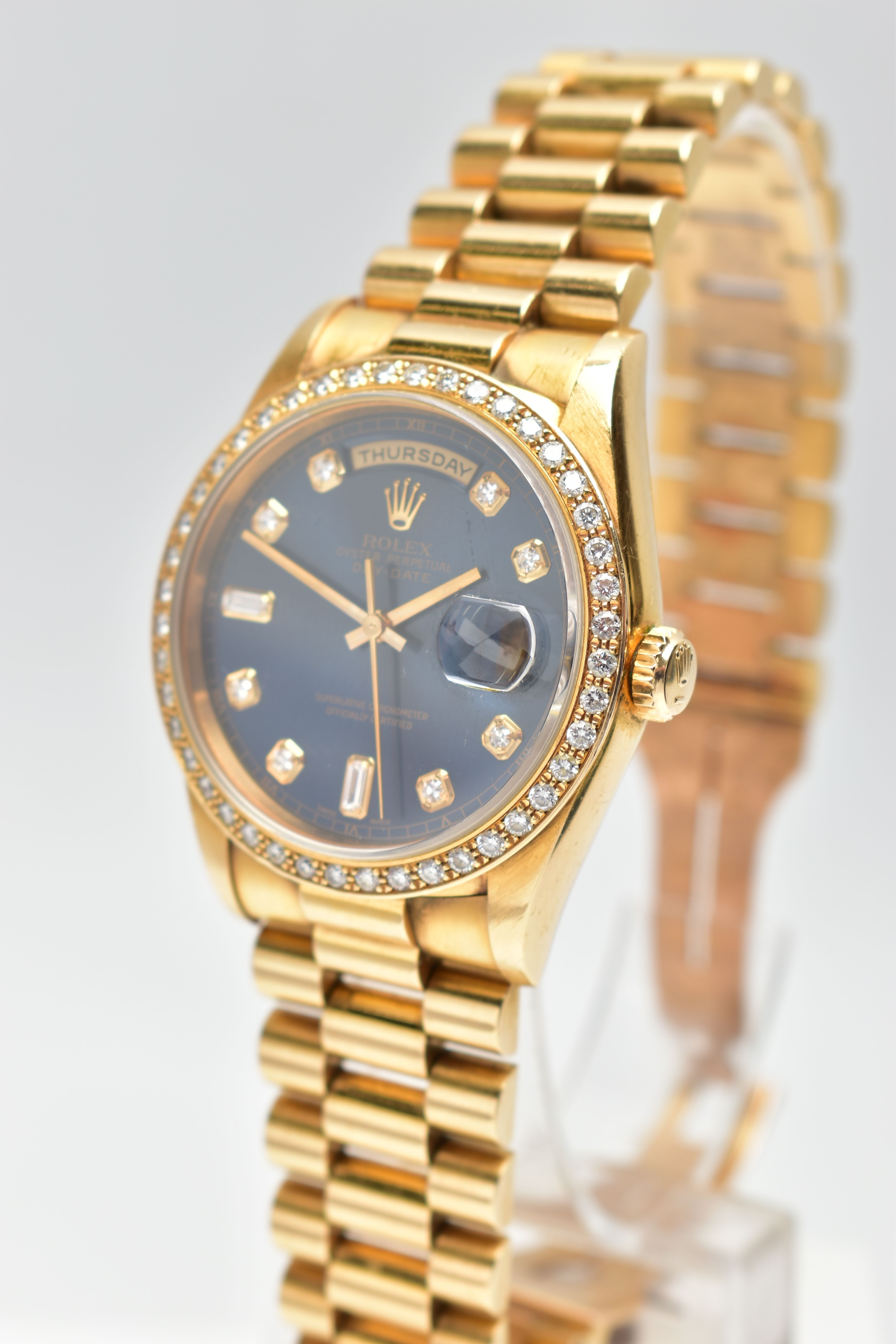 AN 18CT YELLOW GOLD AND DIAMOND DAY-DATE ROLEX WRISTWATCH, the dark blue dial with diamond dot - Image 3 of 15