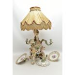 A LATE 19TH CENTURY MEISSEN FIGURAL AND FLORAL ENCRUSTED CENTREPIECE ADAPTED TO A TABLE LAMP, the
