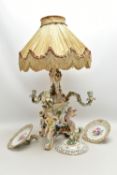 A LATE 19TH CENTURY MEISSEN FIGURAL AND FLORAL ENCRUSTED CENTREPIECE ADAPTED TO A TABLE LAMP, the