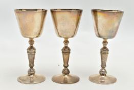 A SET OF THREE ELIZABETH II SILVER GOBLETS, conical bowl on a baluster stem with a circular foot,