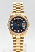 AN 18CT YELLOW GOLD AND DIAMOND DAY-DATE ROLEX WRISTWATCH, the dark blue dial with diamond dot