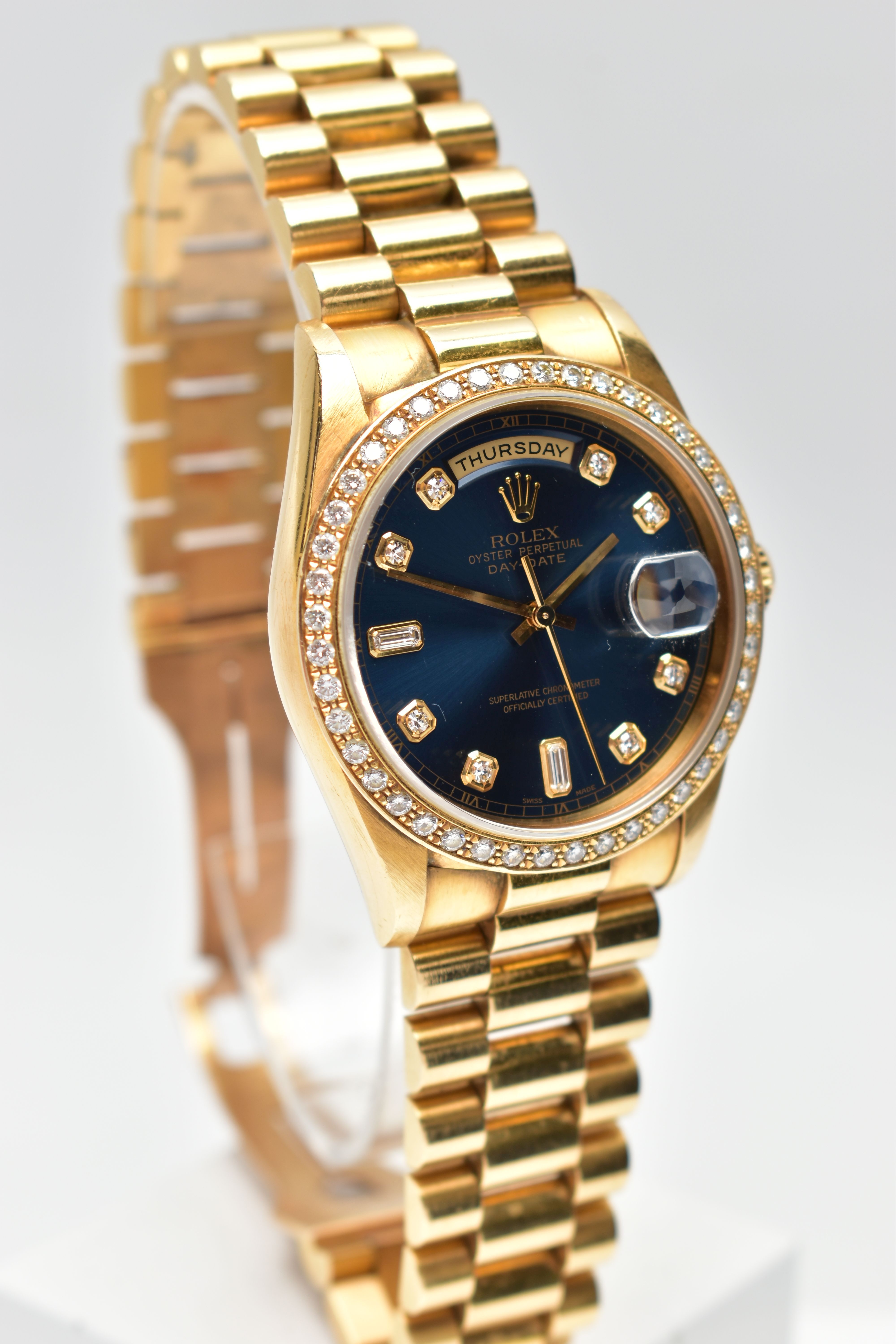 AN 18CT YELLOW GOLD AND DIAMOND DAY-DATE ROLEX WRISTWATCH, the dark blue dial with diamond dot - Image 2 of 15