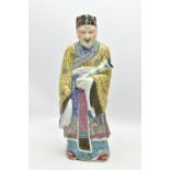 A 20TH CENTURY CHINESE FAMILLE ROSE STANDING FIGURE, modelled as a male wearing flowing robes
