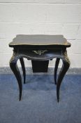 A NAPOLEON III EBONISED AND GILT SERPENTINE WORK TABLE, the hinged top enclosing a rosewood